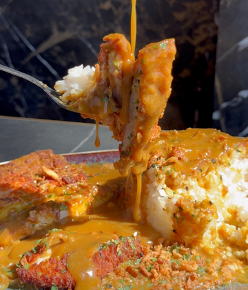 Chicken katsu curry sauce dripping over chicken