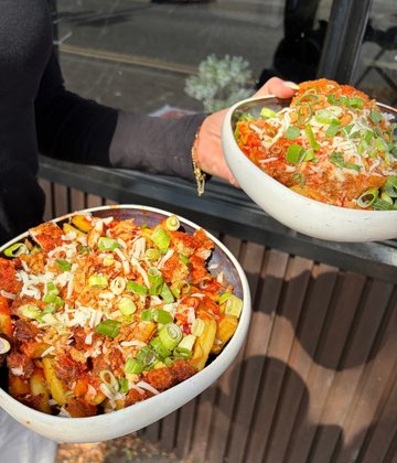 Two plates of katsu loaded fries